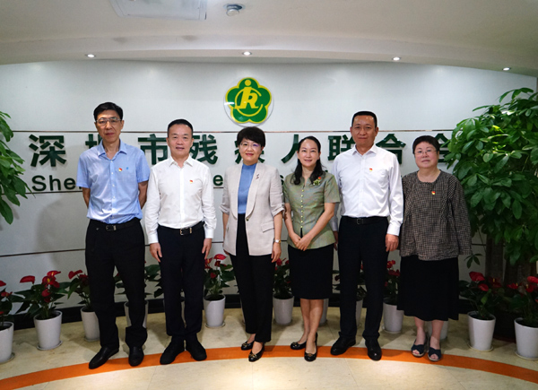 冯玲常委与市残联班子成员合.jpg