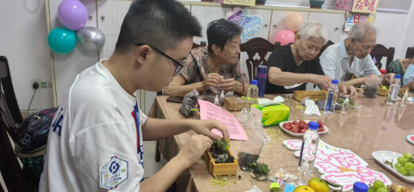 图：黎恒畅参加长城社区活动